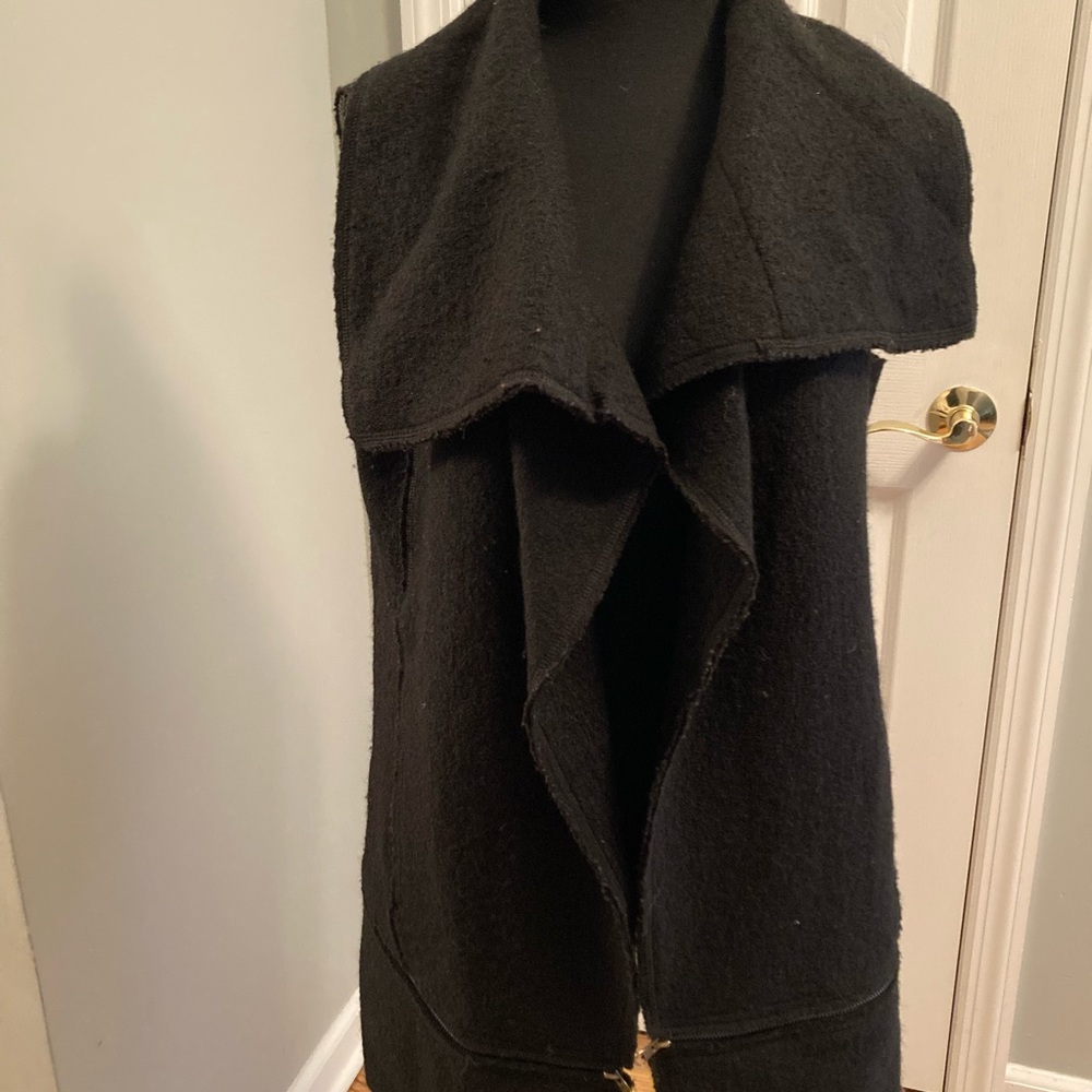 Black wool vest.  Open front no buttons.